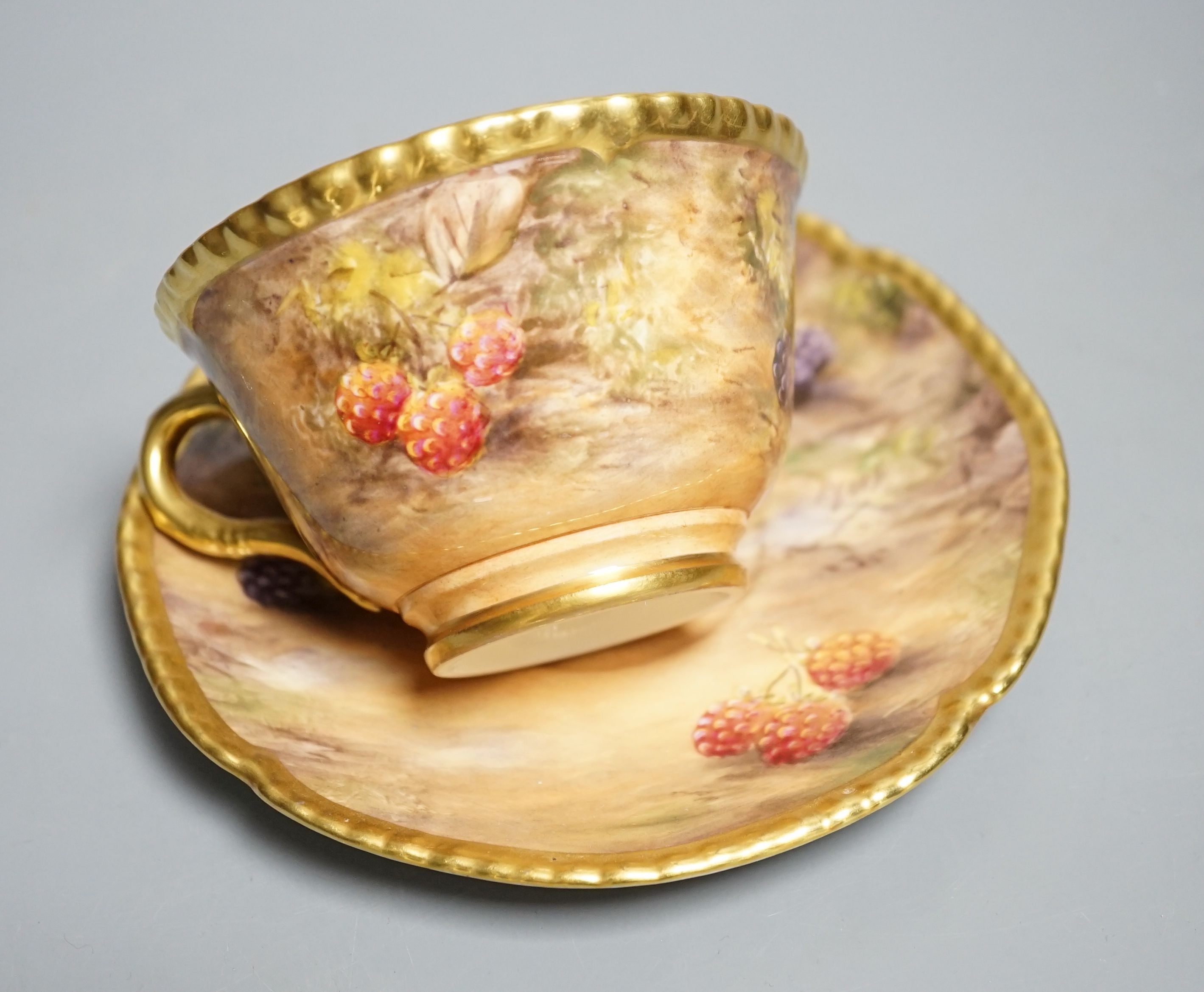 A Royal Worcester fruit painted large tea cup and saucer, signed P. Love, height 7cm overall